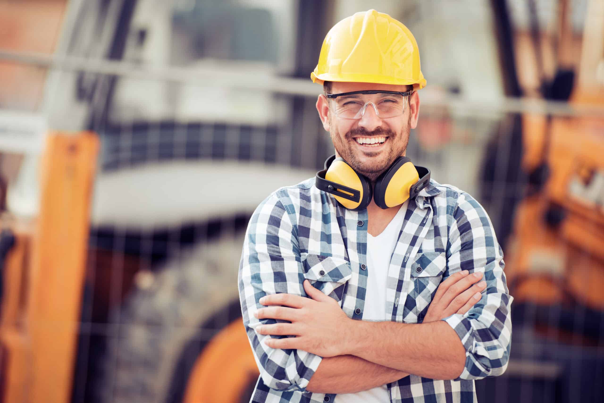 Young construction worker in hard hat Young businessman construction site engineer,close up.