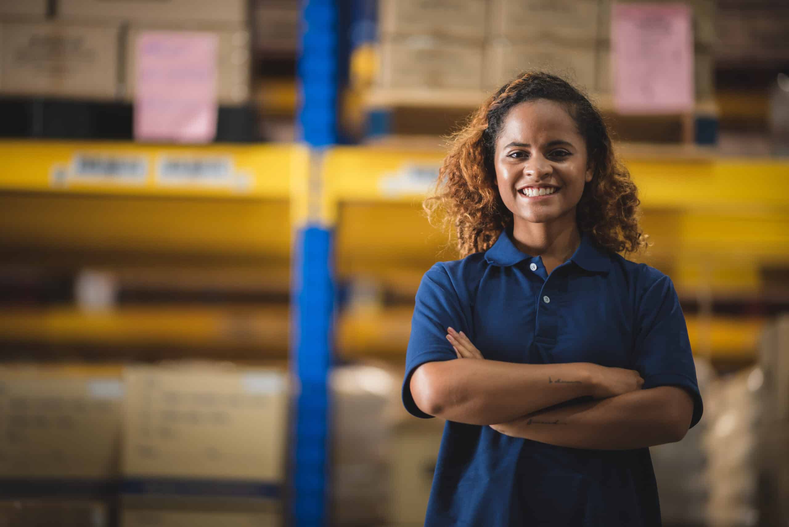 Portrait of African American worker in warehouse, International export business concept Portrait of African American worker in warehouse, International export business concept.