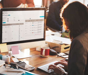 Woman entering eCommerce data into their online store's backend.