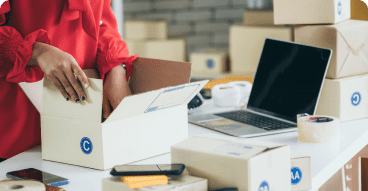 Evolve Shopping Experience Person filling up a package, fulfilling an eCommerce order.