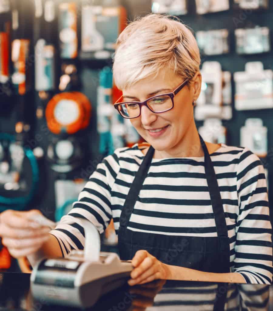 retail-hero Woman operating a cash register.