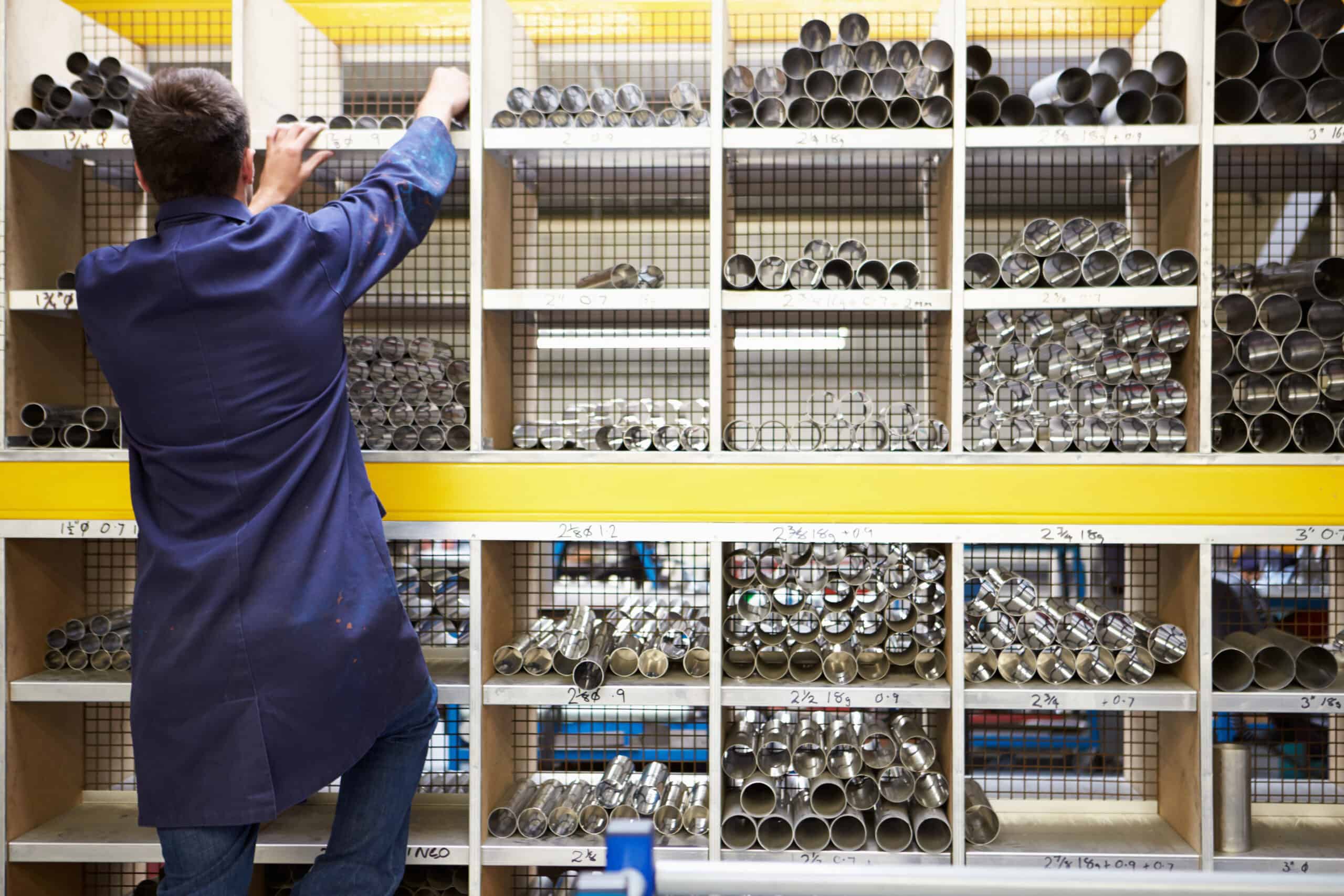 Apprentice Checking Stock Levels In Store Room Wholesale