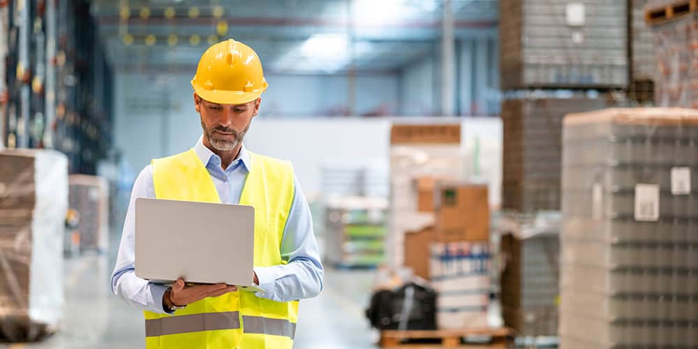 Man in Warehouse on Computer man in warehouse on computer