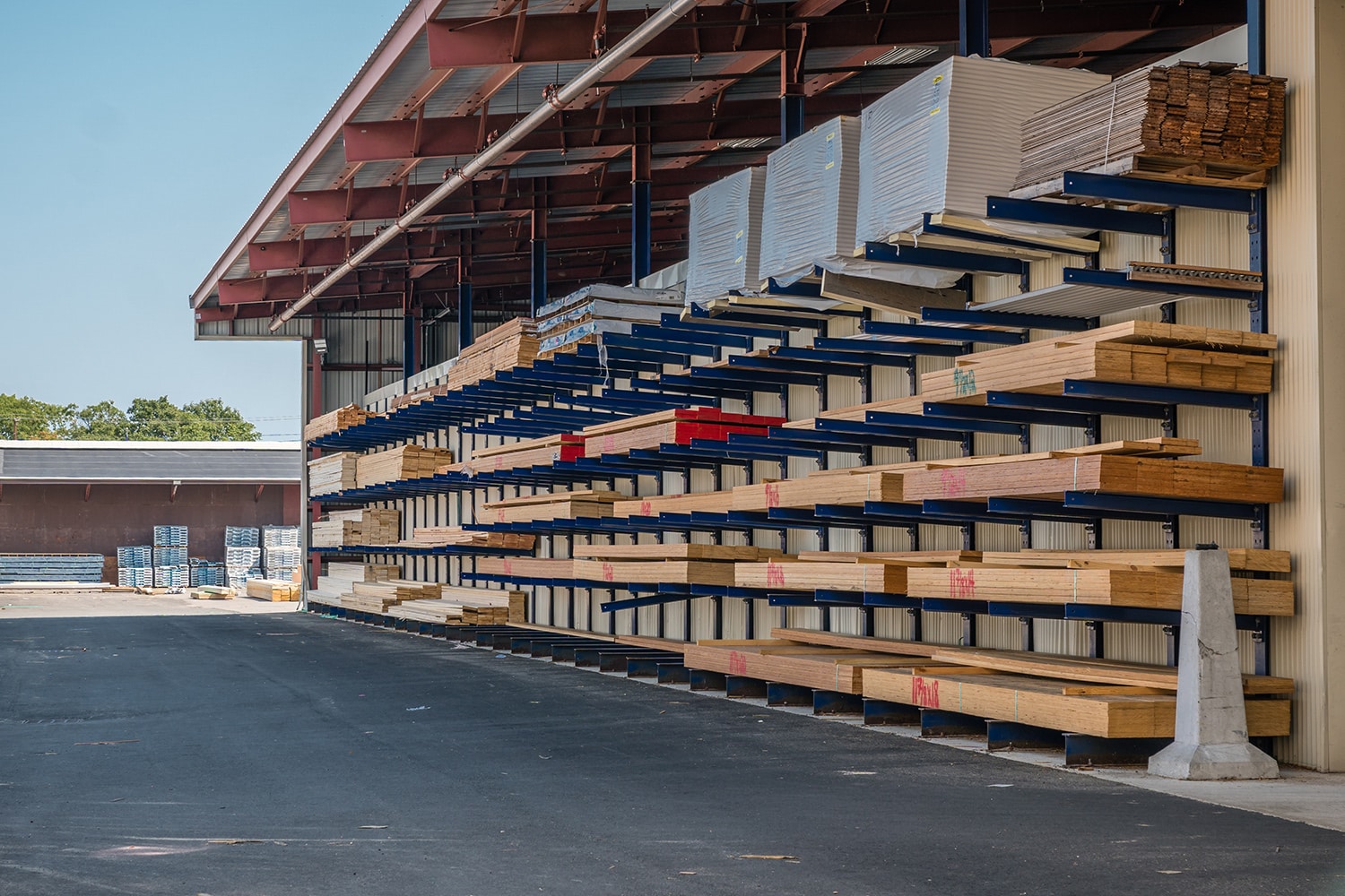 Stacks,Of,Lumber,Being,Stored,In,A,At,A,Lumber hvac tech working